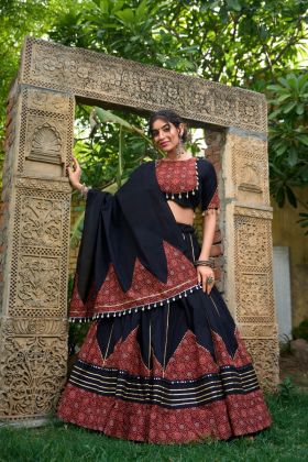 A cotton lehenga set with a gota pati and mirror work that is ready for Navratri